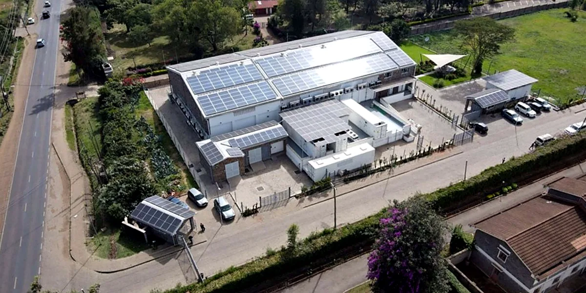Aerial view of a commercial data centre with rooftop solar panels